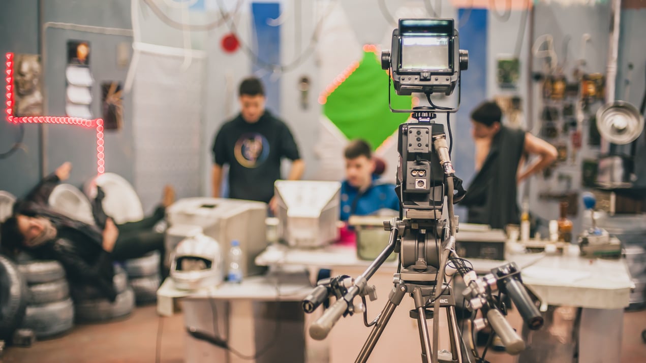 Behind the scene. Film crew filming movie scene in studio