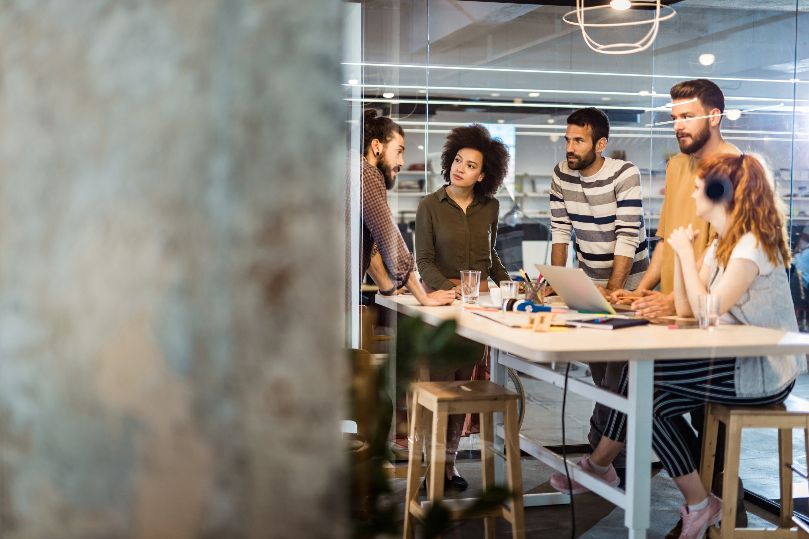 Team of creative people working at casual office.